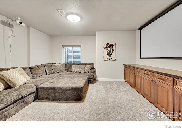 1115 Kestrel Rd, Eaton, CO 80615 - cinema room featuring light carpet and baseboards
