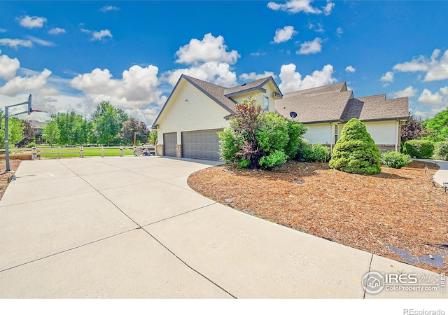 1115 Kestrel Rd, Eaton, CO 80615 - view of front of property featuring concrete driveway and an attached garage