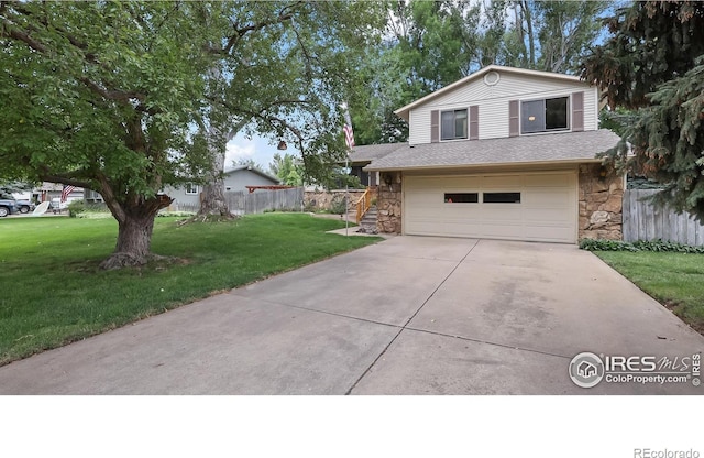 2937 Alamo Ave, Fort Collins, CO 80525 - view of front of property featuring stone siding, a garage, driveway, and a shingled roof