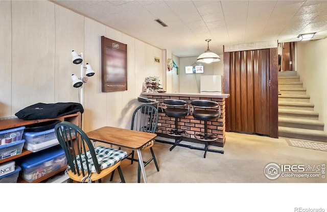 2937 Alamo Ave, Fort Collins, CO 80525 - carpeted dining room featuring stairway