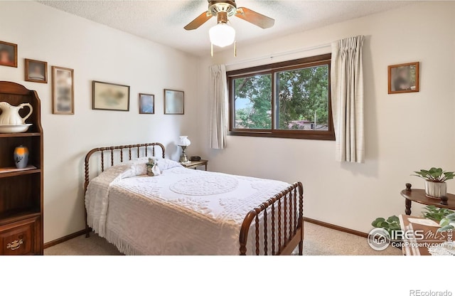 2937 Alamo Ave, Fort Collins, CO 80525 - bedroom featuring light carpet, a ceiling fan, and a textured ceiling