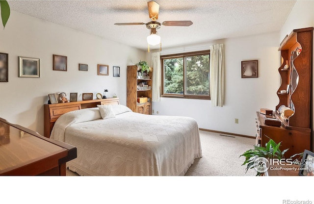 2937 Alamo Ave, Fort Collins, CO 80525 - bedroom with light carpet, a textured ceiling, and a ceiling fan