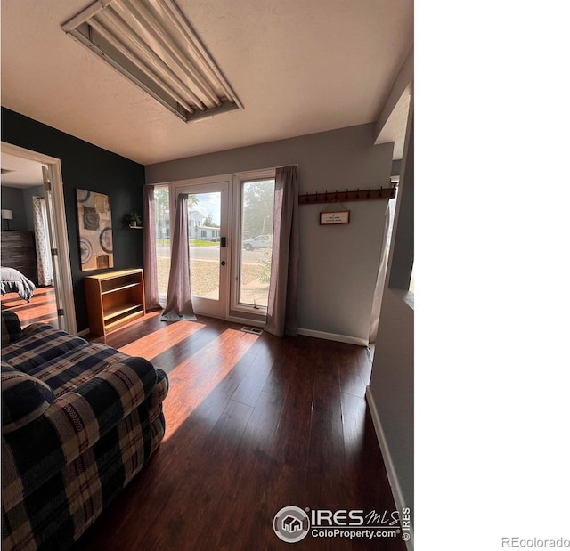1031 N Lincoln Ave, Loveland, CO 80537 - bedroom with access to exterior and hardwood / wood-style floors