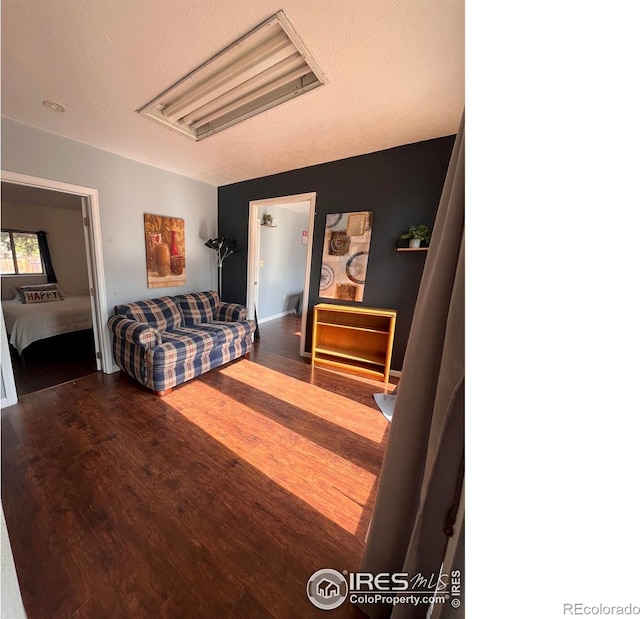 1031 N Lincoln Ave, Loveland, CO 80537 - living room featuring wood finished floors and attic access