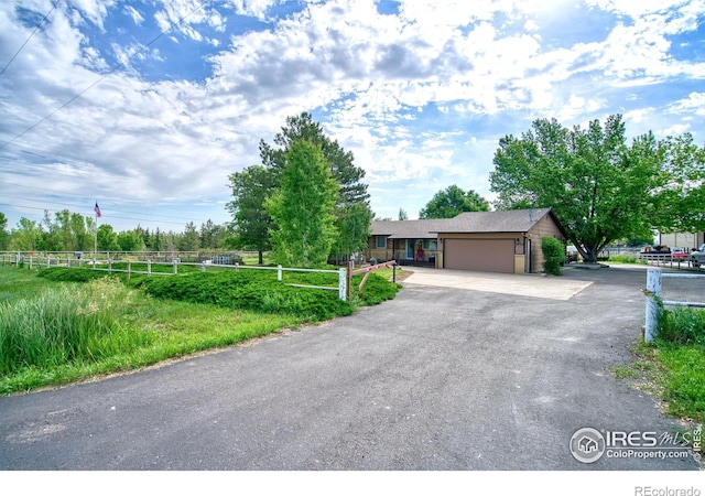 1400 Darton Dr, Johnstown, CO 80534 - ranch-style home featuring asphalt driveway and a garage
