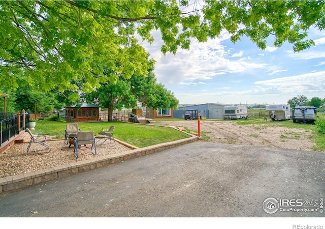 1400 Darton Dr, Johnstown, CO 80534 - view of front facade with an outbuilding and an outdoor fire pit