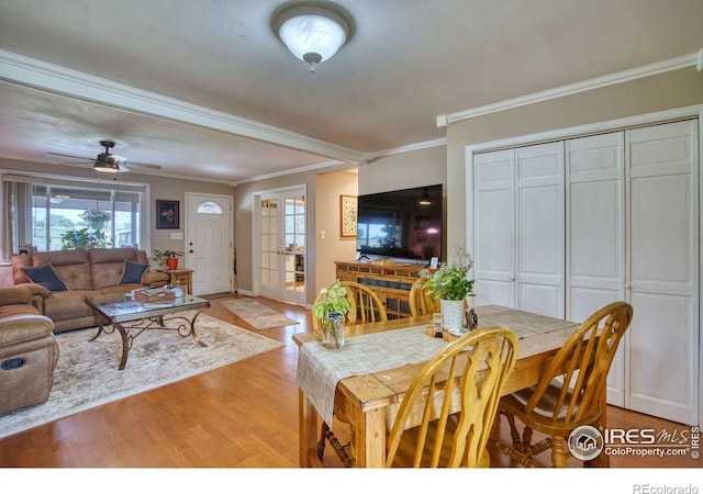 1400 Darton Dr, Johnstown, CO 80534 - dining area with ornamental molding, light wood-style floors, plenty of natural light, and a ceiling fan