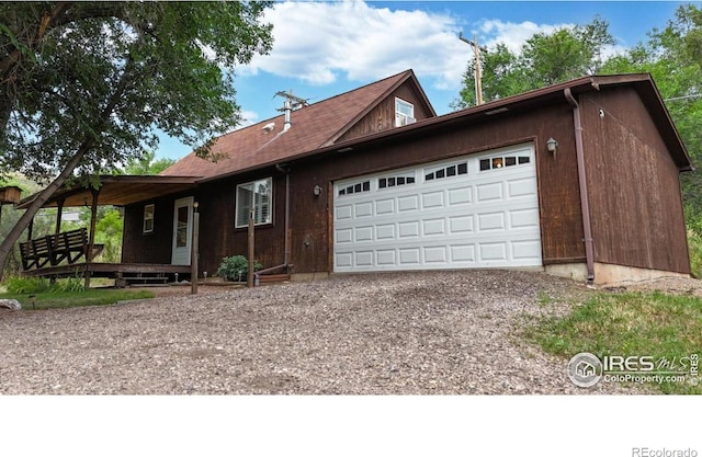 5001 W County Road 38 E, Fort Collins, CO 80526 - view of front of home featuring driveway and an attached garage