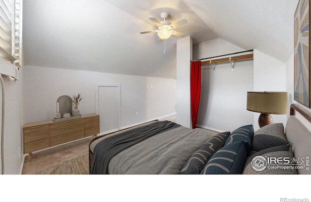 5001 W County Road 38 E, Fort Collins, CO 80526 - carpeted bedroom featuring vaulted ceiling, ceiling fan, and a closet