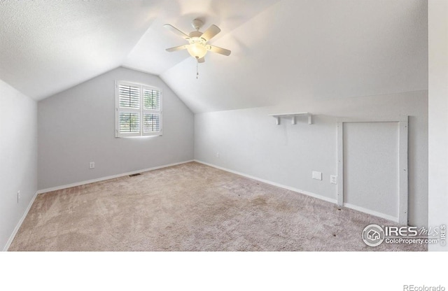 5001 W County Road 38 E, Fort Collins, CO 80526 - additional living space with carpet flooring, ceiling fan, and lofted ceiling