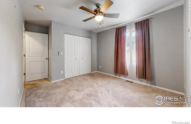 5001 W County Road 38 E, Fort Collins, CO 80526 - unfurnished bedroom with carpet, a closet, and a ceiling fan