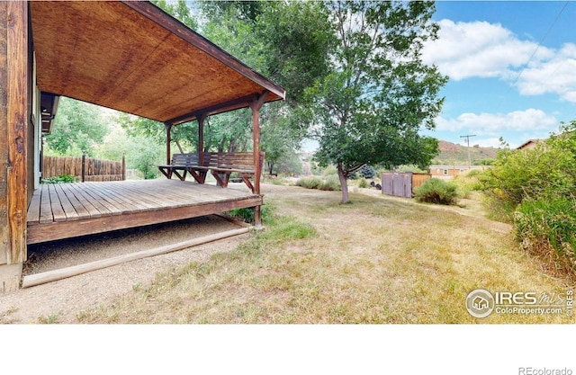 5001 W County Road 38 E, Fort Collins, CO 80526 - view of green lawn featuring a wooden deck
