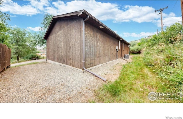 5001 W County Road 38 E, Fort Collins, CO 80526 - view of side of home with a central AC unit