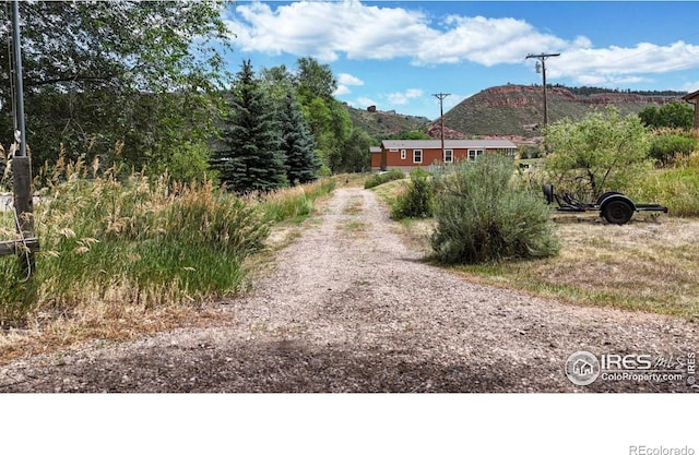 5001 W County Road 38 E, Fort Collins, CO 80526 - view of dirt / gravel road with a mountain view
