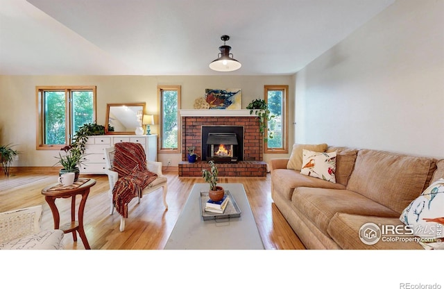2319 Cotswold Ct, Fort Collins, CO 80526 - living room featuring wood finished floors and a brick fireplace