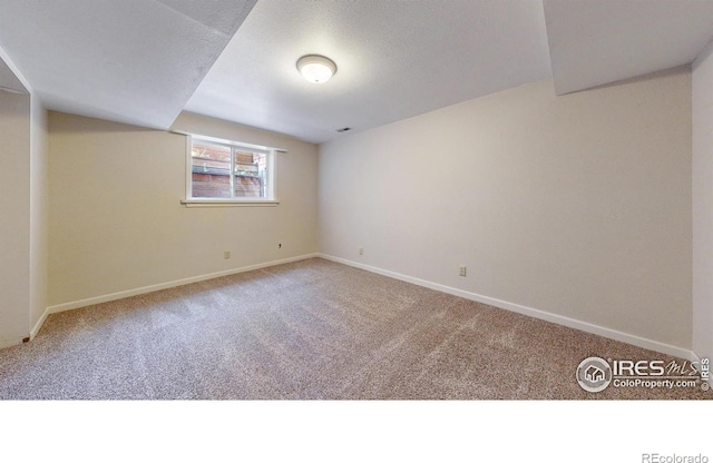 2319 Cotswold Ct, Fort Collins, CO 80526 - carpeted empty room with baseboards and a textured ceiling