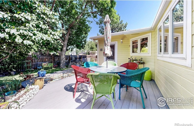 2319 Cotswold Ct, Fort Collins, CO 80526 - wooden deck featuring outdoor dining space