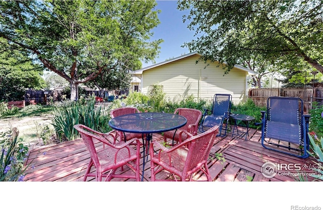 2319 Cotswold Ct, Fort Collins, CO 80526 - wooden deck featuring outdoor dining space