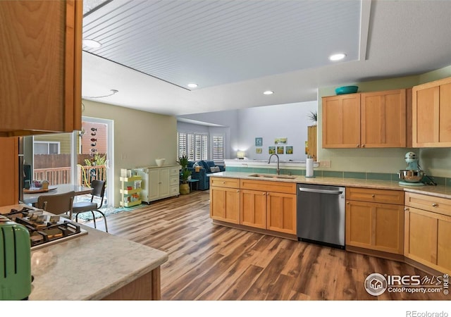 1169 Cooke Ct, Erie, CO 80516 - kitchen featuring dishwasher, light countertops, a peninsula, dark wood-type flooring, and recessed lighting