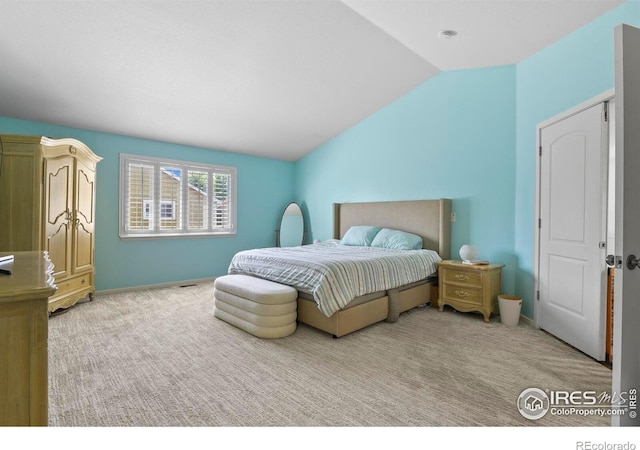 1169 Cooke Ct, Erie, CO 80516 - carpeted bedroom featuring lofted ceiling and baseboards