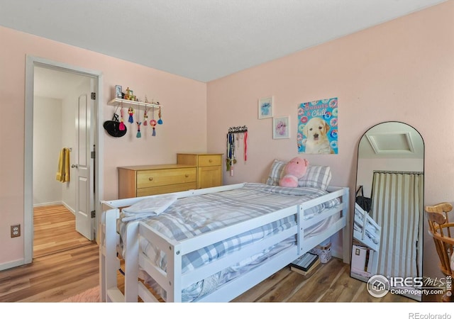 1169 Cooke Ct, Erie, CO 80516 - bedroom with light wood-type flooring and baseboards