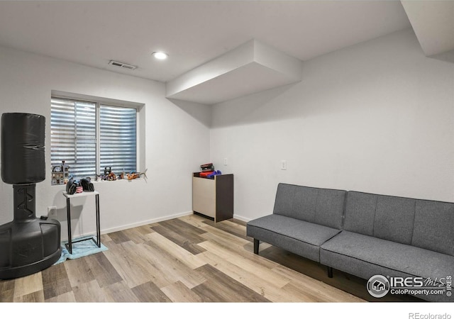 1169 Cooke Ct, Erie, CO 80516 - living area with wood finished floors and recessed lighting