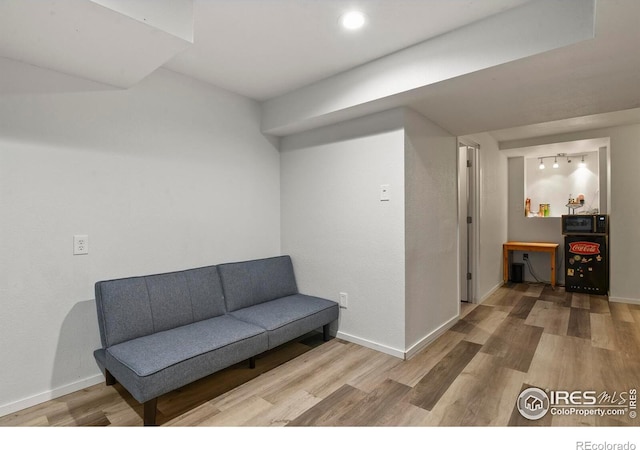 1169 Cooke Ct, Erie, CO 80516 - sitting room with wood finished floors and recessed lighting