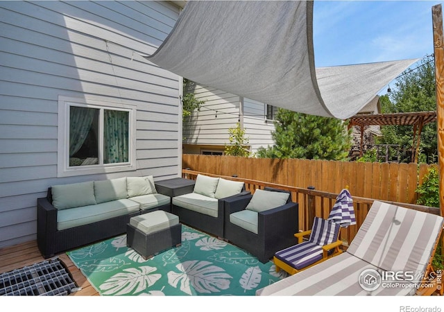 1169 Cooke Ct, Erie, CO 80516 - wooden deck with an outdoor hangout area