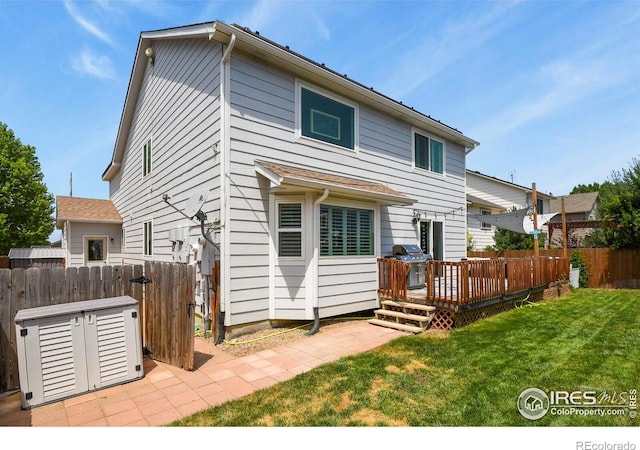 1169 Cooke Ct, Erie, CO 80516 - back of property with a deck
