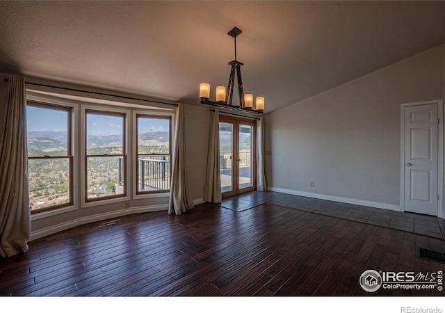 952 Steamboat Valley Rd, Lyons, CO 80540 - spare room with lofted ceiling, a chandelier, dark wood-style floors, and french doors