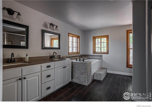 952 Steamboat Valley Rd, Lyons, CO 80540 - full bath featuring wood finished floors, a bath, and double vanity