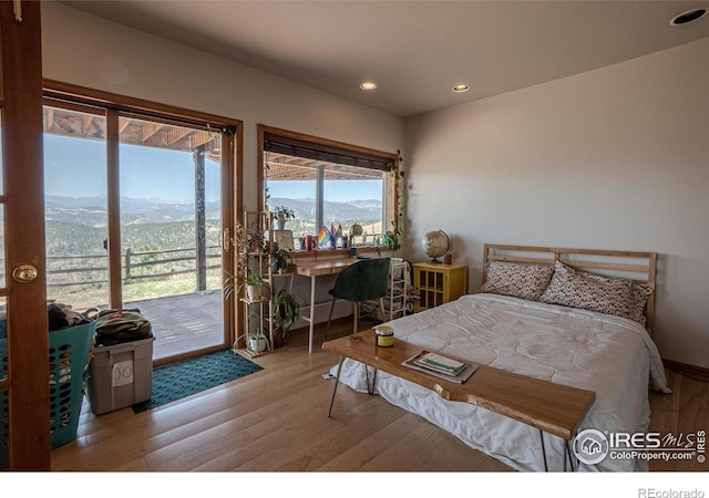 952 Steamboat Valley Rd, Lyons, CO 80540 - bedroom with access to exterior, wood finished floors, recessed lighting, and a mountain view