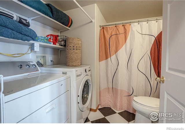 952 Steamboat Valley Rd, Lyons, CO 80540 - laundry area featuring washing machine and dryer and tile patterned floors