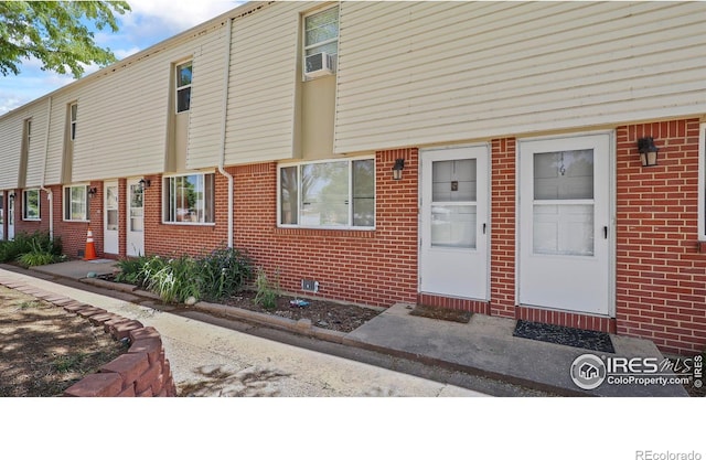 215 Chestnut St Unit A5, Windsor, CO 80550 - view of exterior entry with brick siding