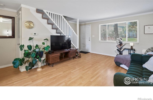 215 Chestnut St Unit A5, Windsor, CO 80550 - living room with stairs, wood finished floors, and crown molding