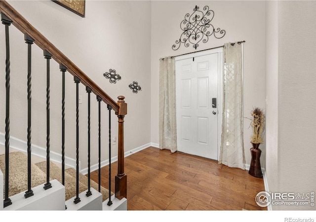 4803 Withers Dr, Fort Collins, CO 80524 - entrance foyer featuring wood finished floors and stairs
