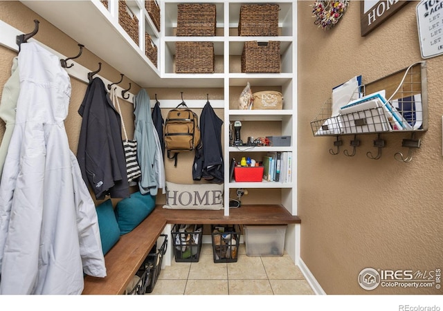 4803 Withers Dr, Fort Collins, CO 80524 - mudroom with tile patterned flooring and a textured wall