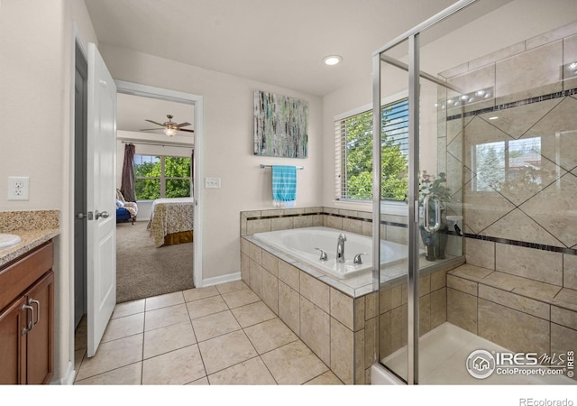 4803 Withers Dr, Fort Collins, CO 80524 - ensuite bathroom featuring vanity, a bath, a shower stall, tile patterned flooring, and ceiling fan
