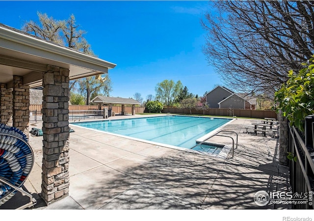 5225 White Willow Dr Unit H210, Fort Collins, CO 80528 - community pool with a fenced backyard and a patio