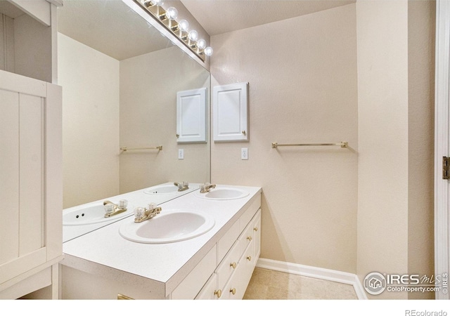 5225 White Willow Dr Unit H210, Fort Collins, CO 80528 - bathroom featuring double vanity and baseboards