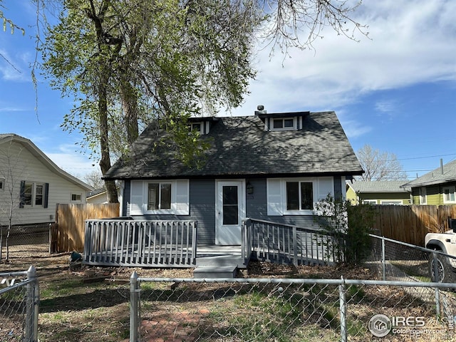 253 7th St, Frederick, CO 80530 - view of front facade with a shingled roof and a wooden deck