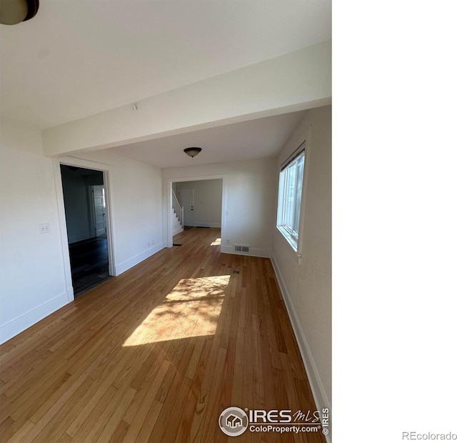 253 7th St, Frederick, CO 80530 - unfurnished room with wood finished floors and stairs