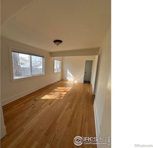 253 7th St, Frederick, CO 80530 - empty room featuring baseboards and light wood finished floors