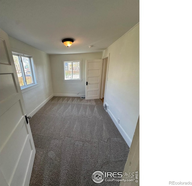 253 7th St, Frederick, CO 80530 - carpeted spare room featuring baseboards