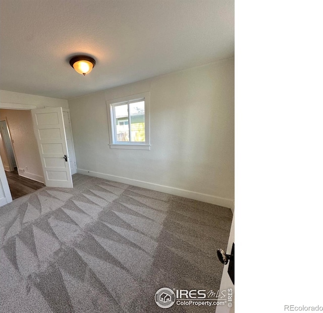 253 7th St, Frederick, CO 80530 - unfurnished bedroom with carpet flooring and a textured ceiling