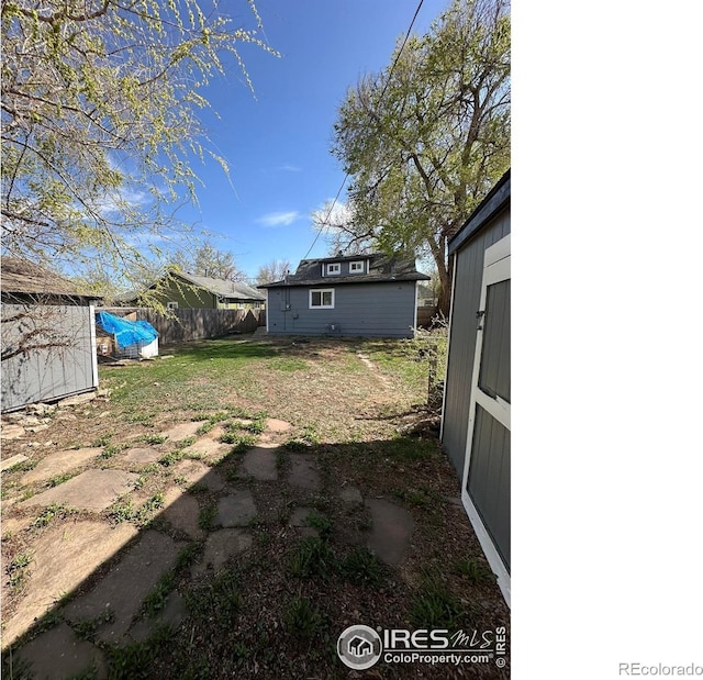 253 7th St, Frederick, CO 80530 - view of yard with a storage shed
