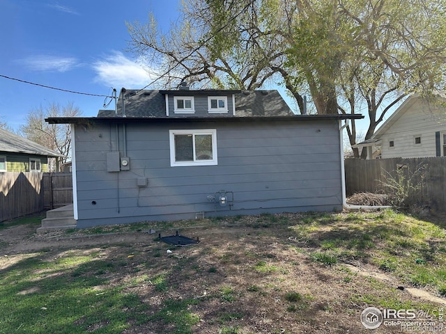 253 7th St, Frederick, CO 80530 - view of property exterior with a fenced backyard and roof with shingles