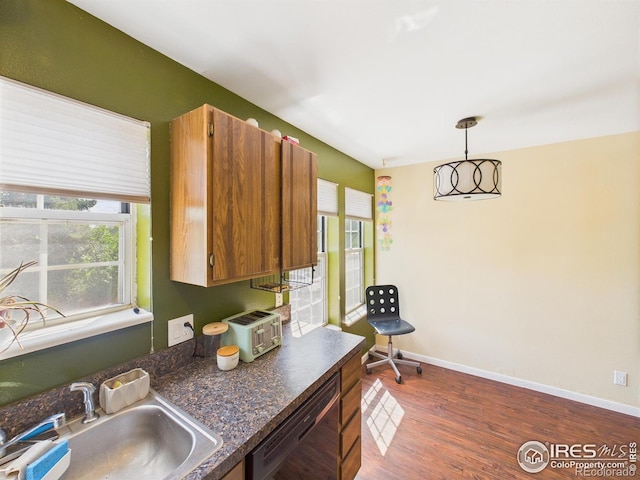 3200 Azalea Dr # 6, Fort Collins, CO 80526 - kitchen with dark countertops, dishwasher, dark wood-style floors, pendant lighting, and brown cabinetry