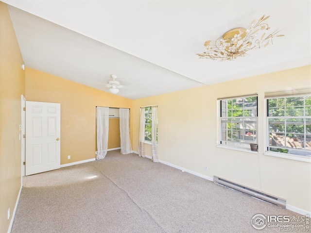 3200 Azalea Dr # 6, Fort Collins, CO 80526 - unfurnished bedroom featuring a baseboard heating unit, multiple windows, carpet, lofted ceiling, and a closet