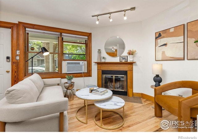 1430 18th St Unit 1, Boulder, CO 80302 - living area with light wood-style flooring, a fireplace with flush hearth, and rail lighting